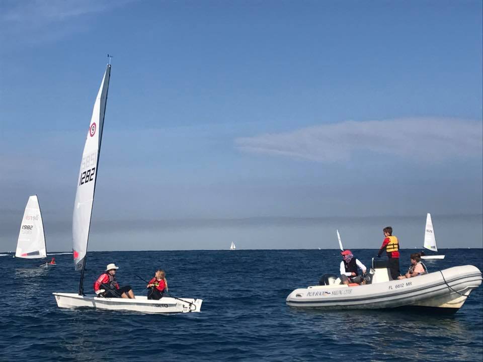 1Marc Jacobi has picked up a passenger from the Palm Beach Sailing Club Junior Sailing